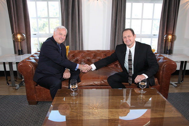 Image of Jim Beeno (right) shaking hands with Jack Canfield on an appearance of his show Hollywood Live show.